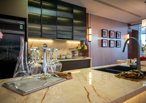 Modern kitchen with marble island and stainless steel cabinets