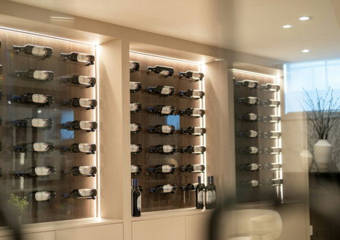 Modern wine cellar with illuminated bottle racks